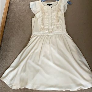 Cream flowing dress with chest pleating details